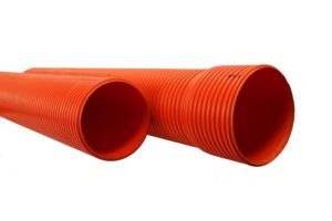 Two large, bright orange pipes lie parallel on a plain white background. The pipes have a ribbed texture and open ends. Vinidex XGuard Heavy Duty Electrical Conduit